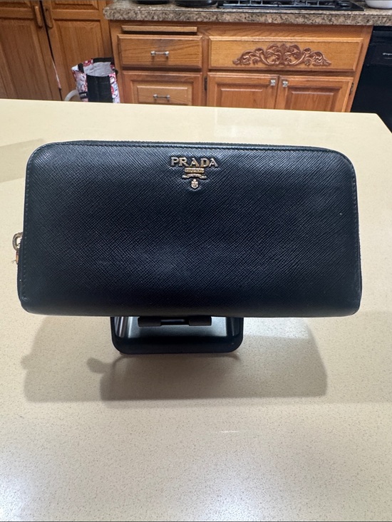 Prada Handbags - Prada Black Saffiano Zip-Around Wallet with Gold Logo. Authentic